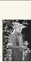 Louie holding a glass of his homemade Cabernet