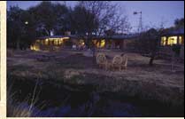 View of main guest and bed/breakfast building, looking across Turkey Creek