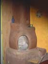 Kitchen fireplace, handcrafted from molded clay, straw and pumice