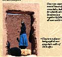Clay/straw plaster being applied over straw bale walls of Save the Children office
